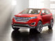 Ein roter Ford Edge Concept steht 2013 in einer Fabrikhalle.