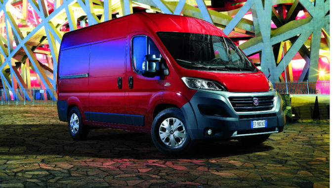 Ein roter Ducato Goods steht abends vor einem Sportstadion(06/2016)