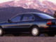 Ein blauer Honda Accord der fünften Generation steht 1994 vor einem Berggipfel.