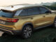 Ein goldener Skoda Kodiaq (MY2026) steht an eine Küste.