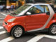 10 Jahre smart: smart fortwo passion cabrio - ein rotes exemplar fährt 2008 durch new york